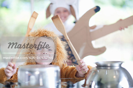 Children pretending to play music instruments