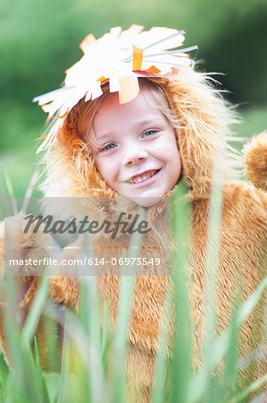 Child wearing lion costume