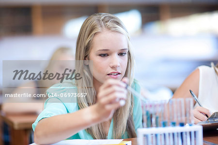 School girls enjoying science lesson