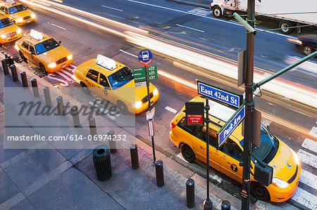 High angled view of yellow cabs in a row at pedestrian crossing New York City, USA High angled view of yellow cabs in a row at pedestrian crossing New York City, USA