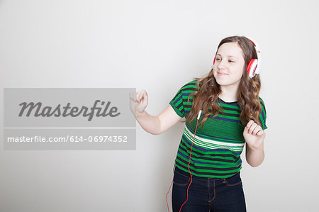 Girl dancing wearing headphones