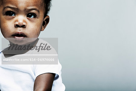 Portrait of baby boy wearing white vest