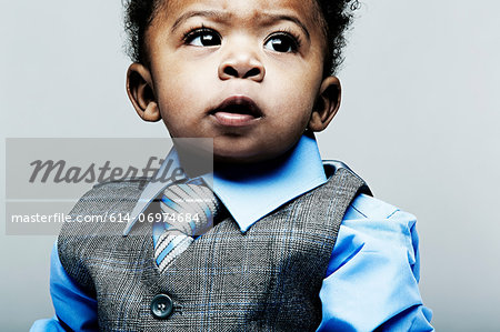 Portrait of baby boy wearing waistcoat, shirt and tie