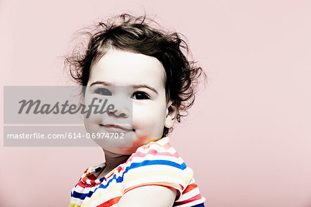 Portrait of baby girl wearing striped top