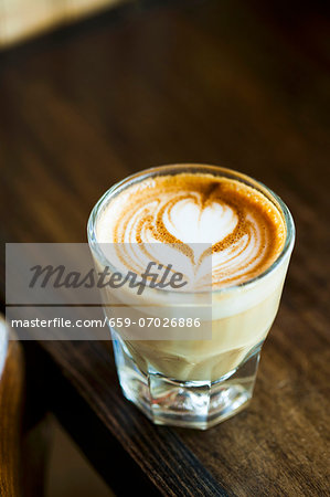 Latte with a Heart Design in a Glass Latte with a Heart Design in a Glass