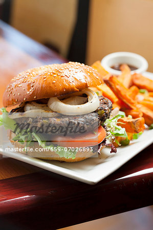 Veggie Burger with Lettuce, Tomato and Onion; Served with Sweet Potato Fries