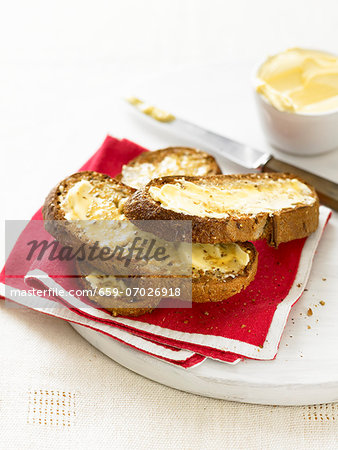 Toasted slices of bread with butter