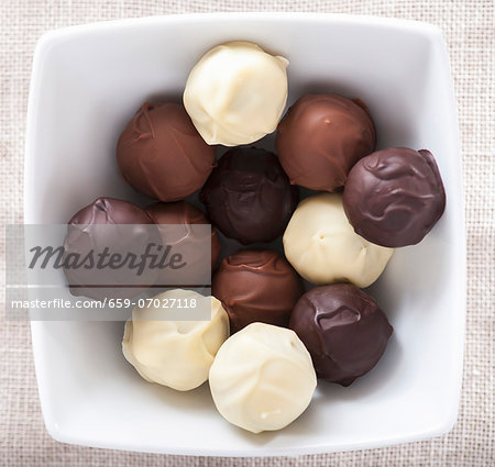 Assorted home-made chocolate truffles in a bowl