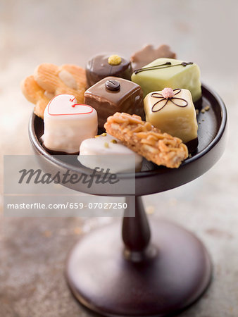 Assorted biscuits and petits fours on a cake stand