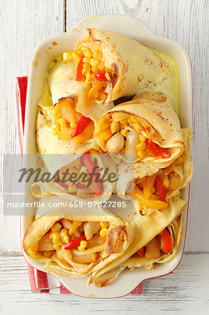 Pancakes filled with chicken, peppers and pineapple, in garlic sauce Pancakes filled with chicken, peppers and pineapple, in garlic sauce
