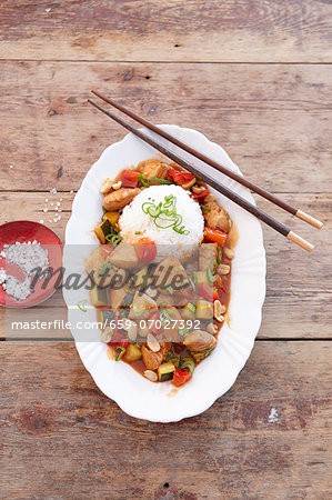 Spicy chicken dish with peanuts, served with rice (Asia) Spicy chicken dish with peanuts, served with rice (Asia)