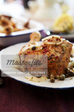 Chicken leg with olives and capers