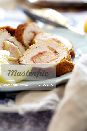 Chicken Cordon Bleu with lemon wedges Chicken Cordon Bleu with lemon wedges