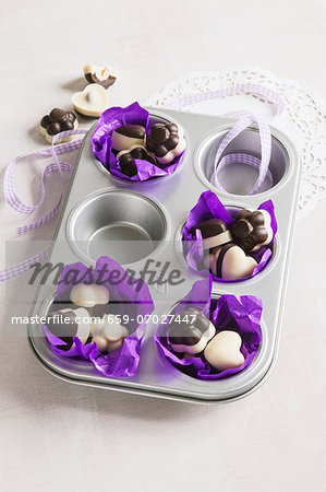 Hazelnuts with chocolate glaze in a muffin tin