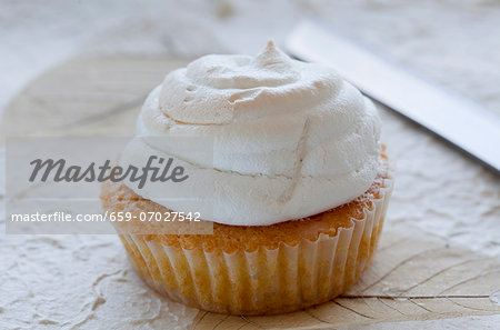 A muffin with a meringue top
