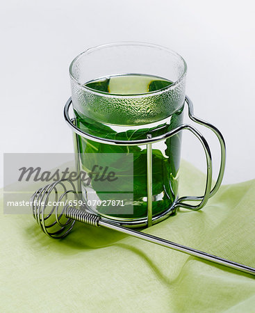 A Glass of Mint Tea with Fresh Mint Leaves