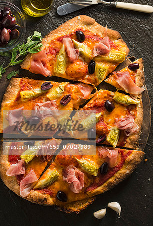 Pancetta, Artichoke and Olive Pizza; Sliced