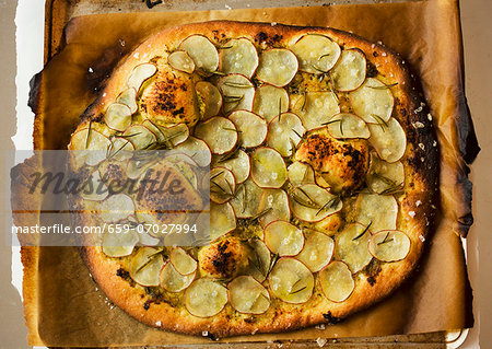 Thin Crust Pizza with Sliced Potato and Rosemary; From Above Thin Crust Pizza with Sliced Potato and Rosemary; From Above