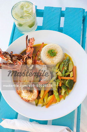 Halved Lobster with Couscous and Vegetables; In a White Bowl