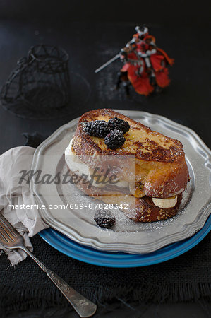 Challa French toast with chocolate hazelnut spread, caramelised bananas and blackberries