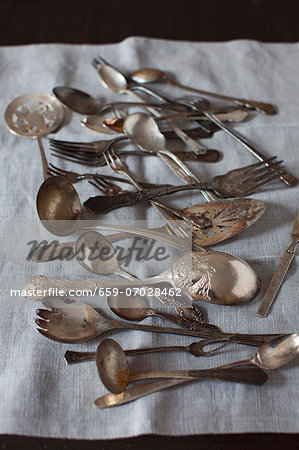 Old Spoons and Forks on Linen