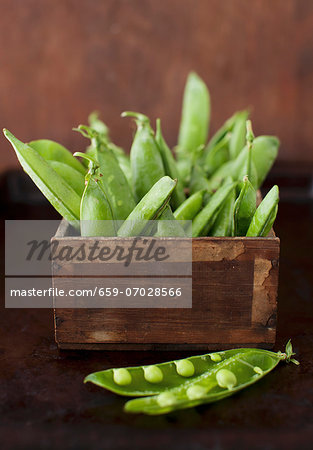 Pea Pods in a Box; One Pod Split Open