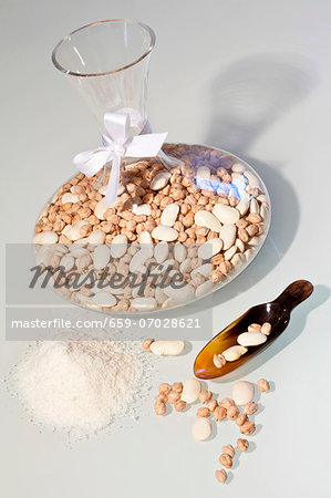 Dried beans and chickpeas in a carafe as a gift