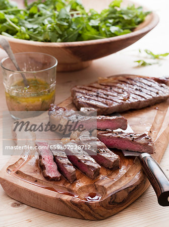 Grilled beef steak with a rocket salad