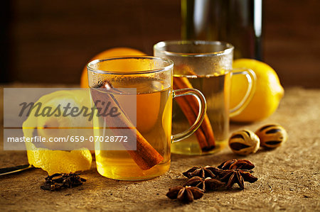 White Glühwein (German mulled wine) with spices and lemons