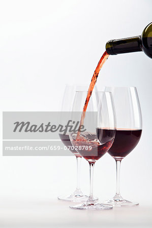 Red wine being poured