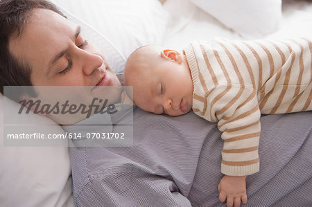 Mid adult man resting with son
