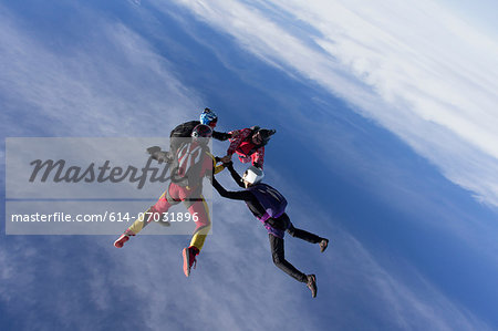 Small group of skydivers in formation