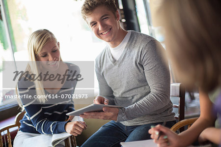 Small group of people studying together in cafe