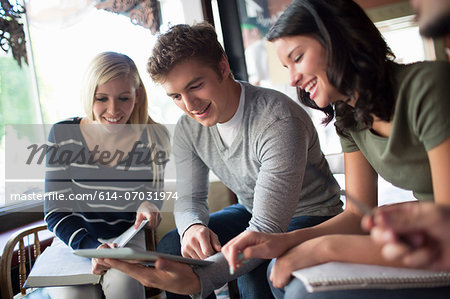 Group of people studying together in cafe