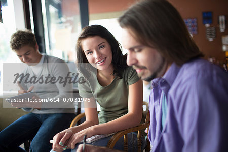 Group of people studying together in coffee shop