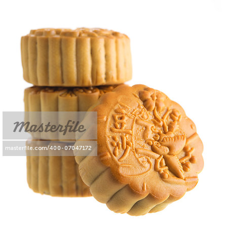 Traditional mooncakes isolated on white background. Chinese mid autumn festival foods. The Chinese words on the mooncakes means red bean paste, not a logo or trademark.