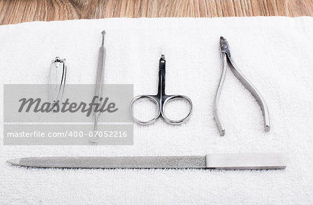 Set of manicure instruments on a towel