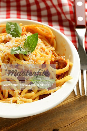 spaghetti pasta with tomato sauce, basil and parmesan cheese