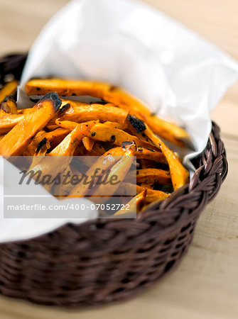 close up of a basket of sweet potato fries