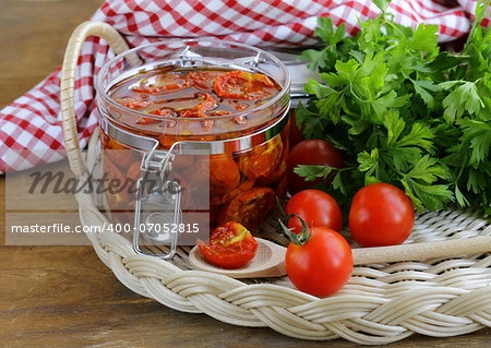 sun-dried tomatoes with herbs and olive oil in the pot