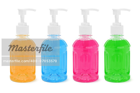 Colorful Liquid Soap In Plastic Bottles On White