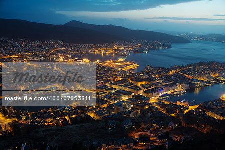 This is a top view of Bergen (the west coast of Norway) in night. The town is illuminated.
