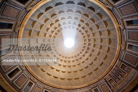 Roman Pantheon's dome and the opening at the top called the Oculus with sun streaming through