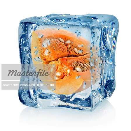 Pumpkin in ice cube isolated on a white background