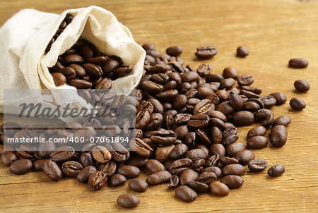 roasted coffee beans on a wooden table