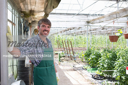 Portrait of organic farmer in greenhouse