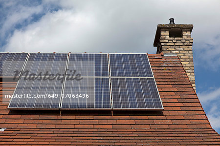 Close up of house roof with solar panels