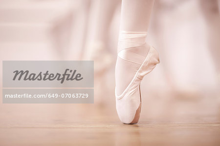 Detail of ballerinas legs in dance studio
