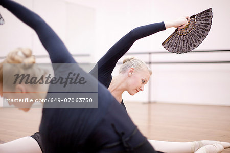 Ballerinas in symmetrical floor pose