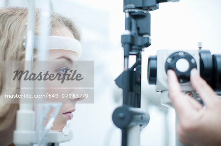 Female having her eyes examined